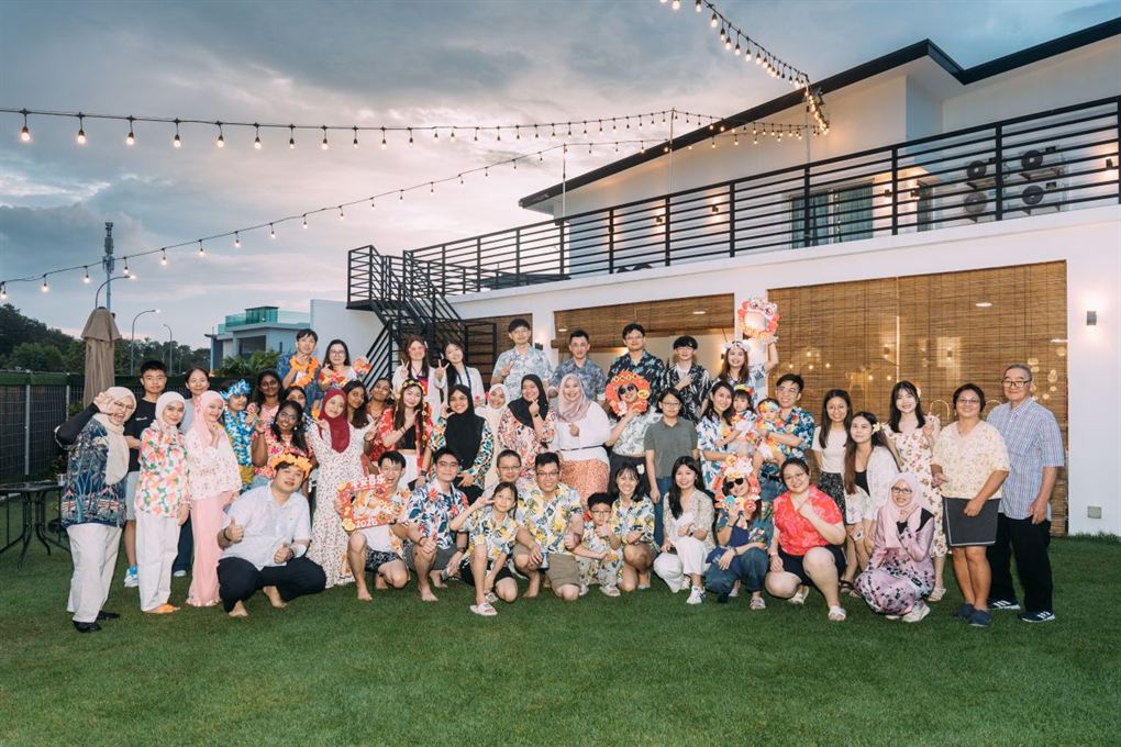 WS Group team gathered on the lawn at a company retreat